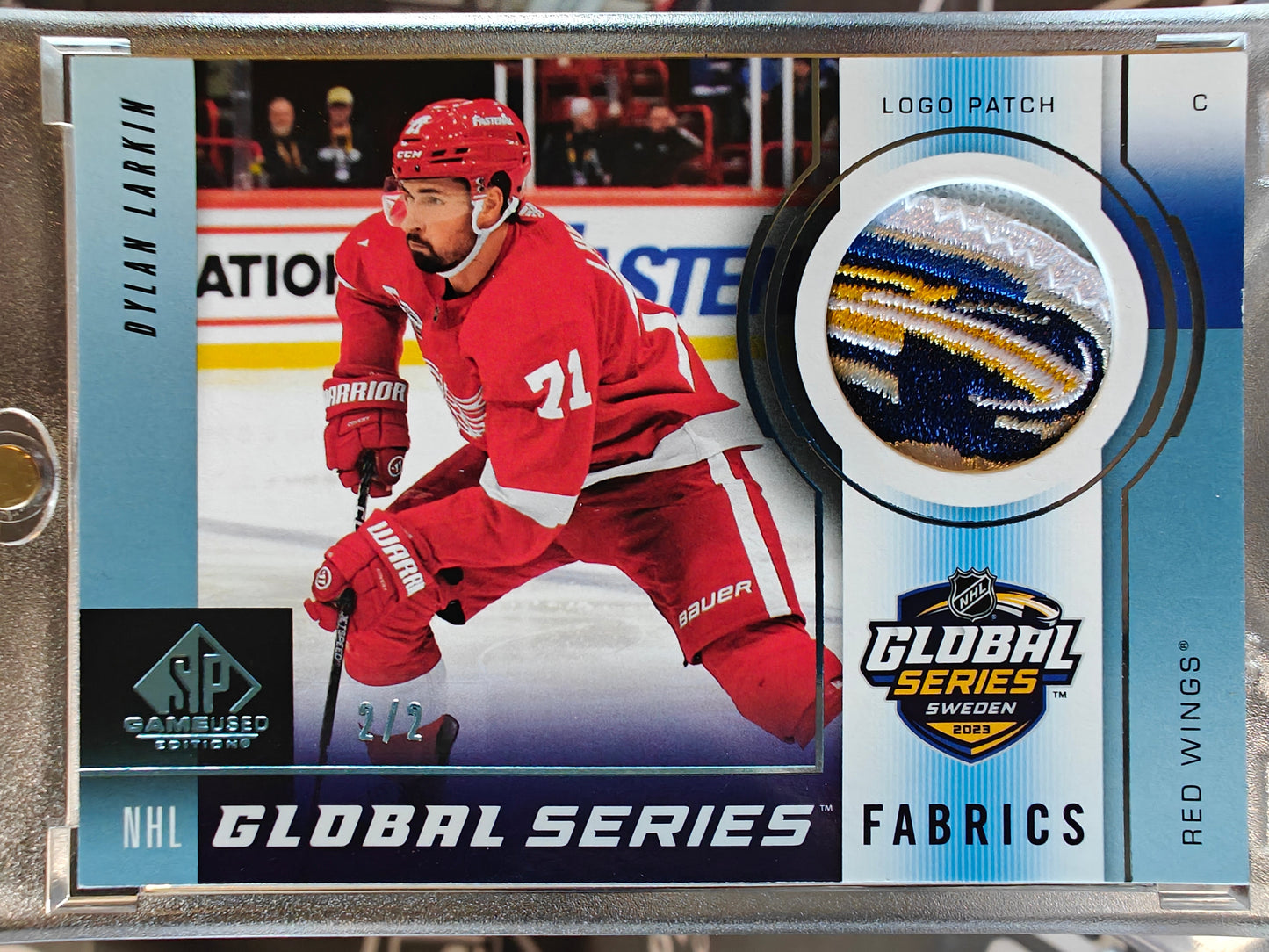2024-25 SP Game Used Dylan Larkin #GSF-DL Global Series Fabrics Shield Patch /2